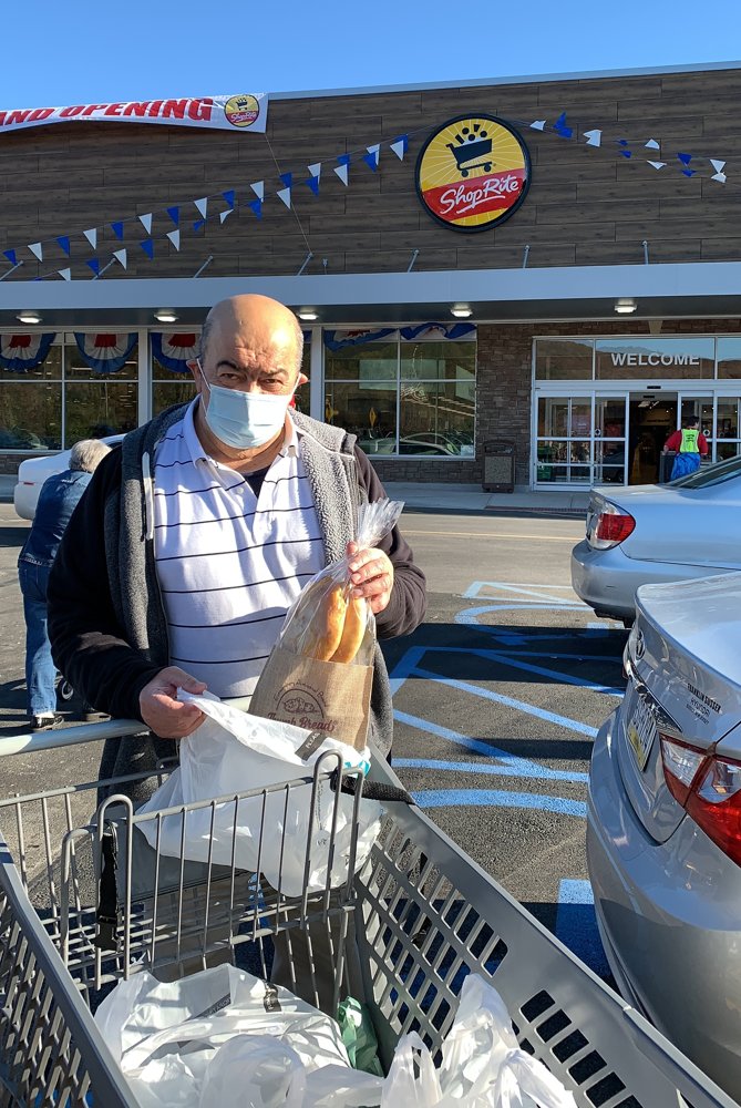 Our late father, Baba, with a bag of Thumb Bread® and a grocery cart outside a ShopRite