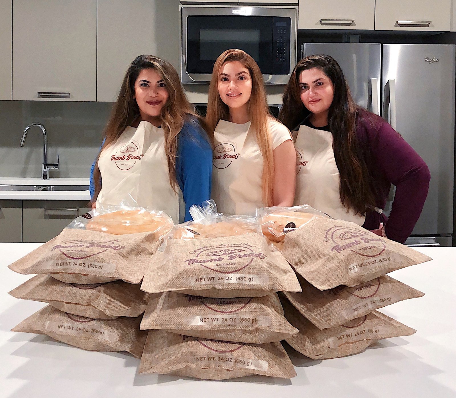 Fusun, Gonca and Arzu Esendemir with Thumb Bread® in its burlap bags