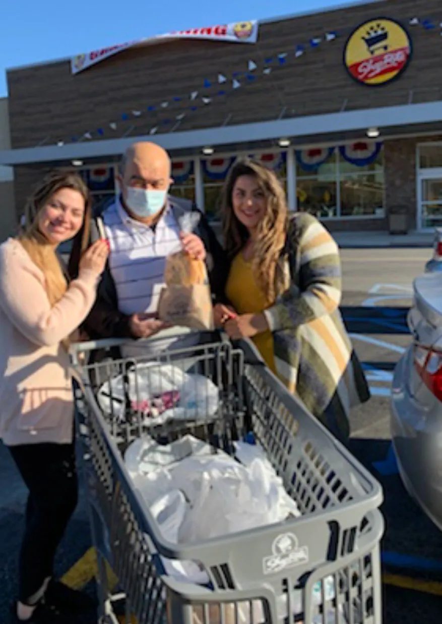 Baba with his daughters outside a ShopRite