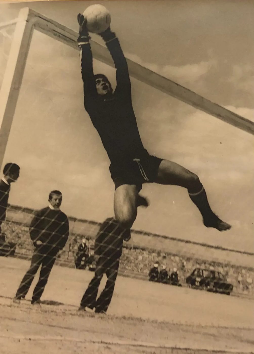 Baba diving for the ball as a soccer goalkeeper