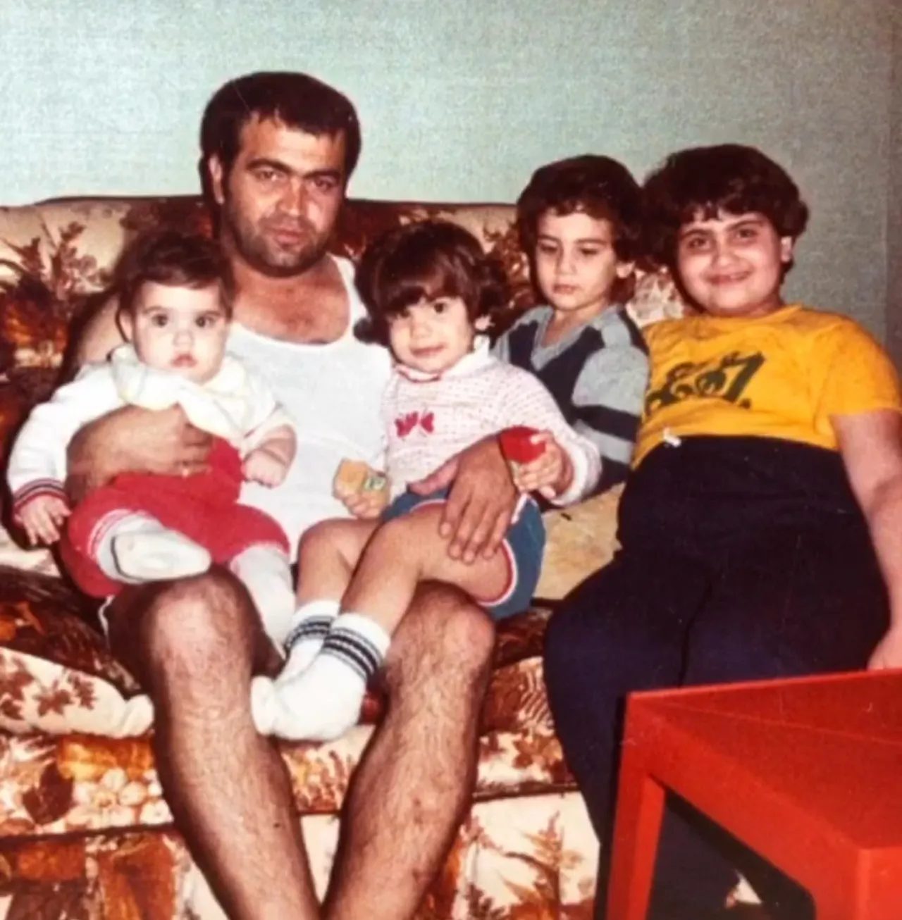 Baba with his children on the couch