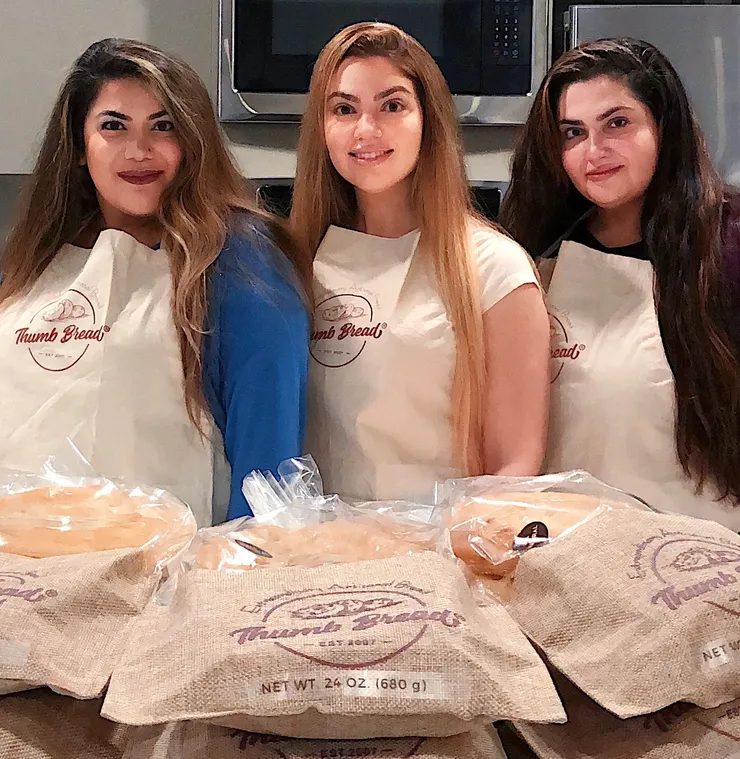 Fusun, Gonca and Arzu Esendemir in Thumb Bread® aprons with bags of Thumb Bread®