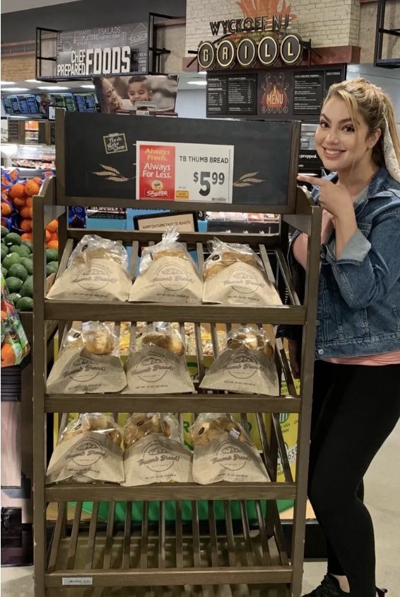 Arzu Esendemir next to a Thumb Bread® display at ShopRite of Wyckoff