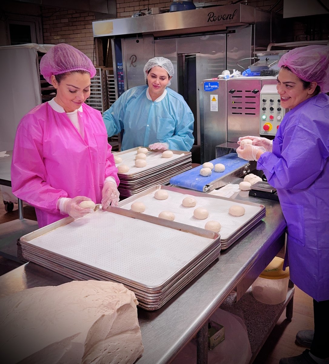 The three Esendemir sisters shaping Thumb Bread® dough by hand