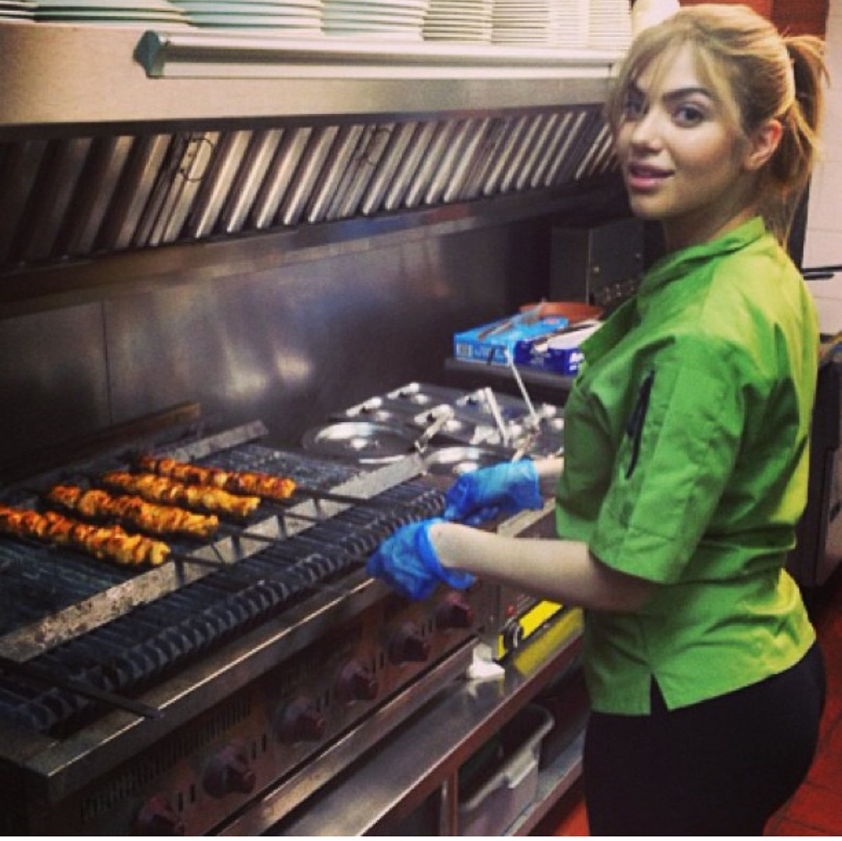 One of the Esendemir sisters cooking on the grill at Flatbread Grill®