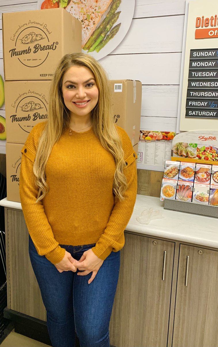 One of the Esendemir sisters with Thumb Bread® in a store