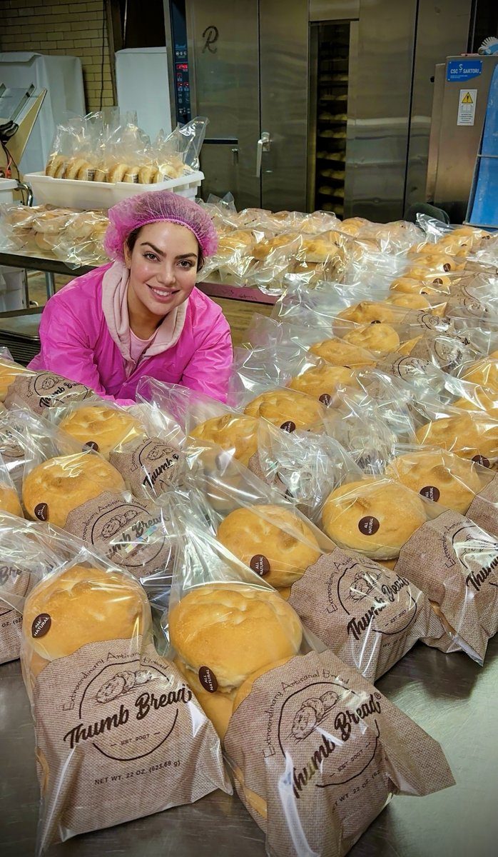 One of the Esendemir sisters surrounded by freshly packed Thumb Bread®