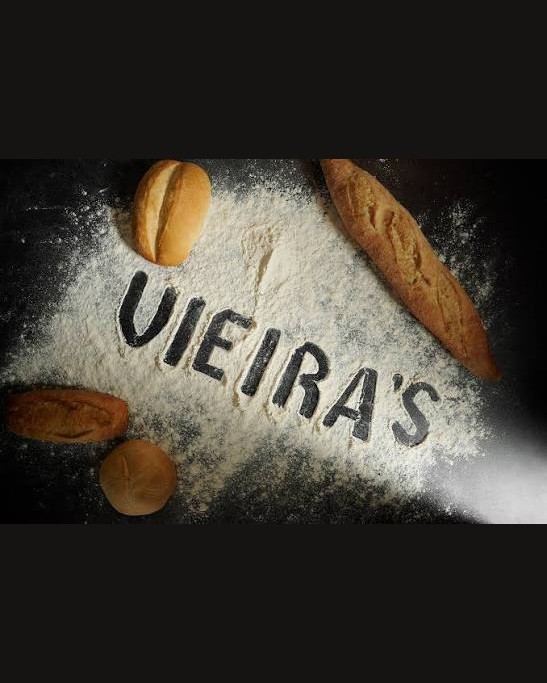Vieira's Bakery name written in flour with Portuguese rolls